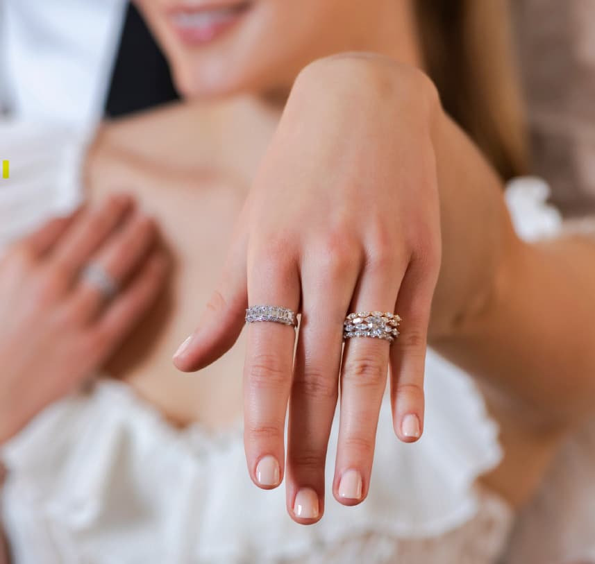 Bride showing her hand wearing Imagine Bridal rings