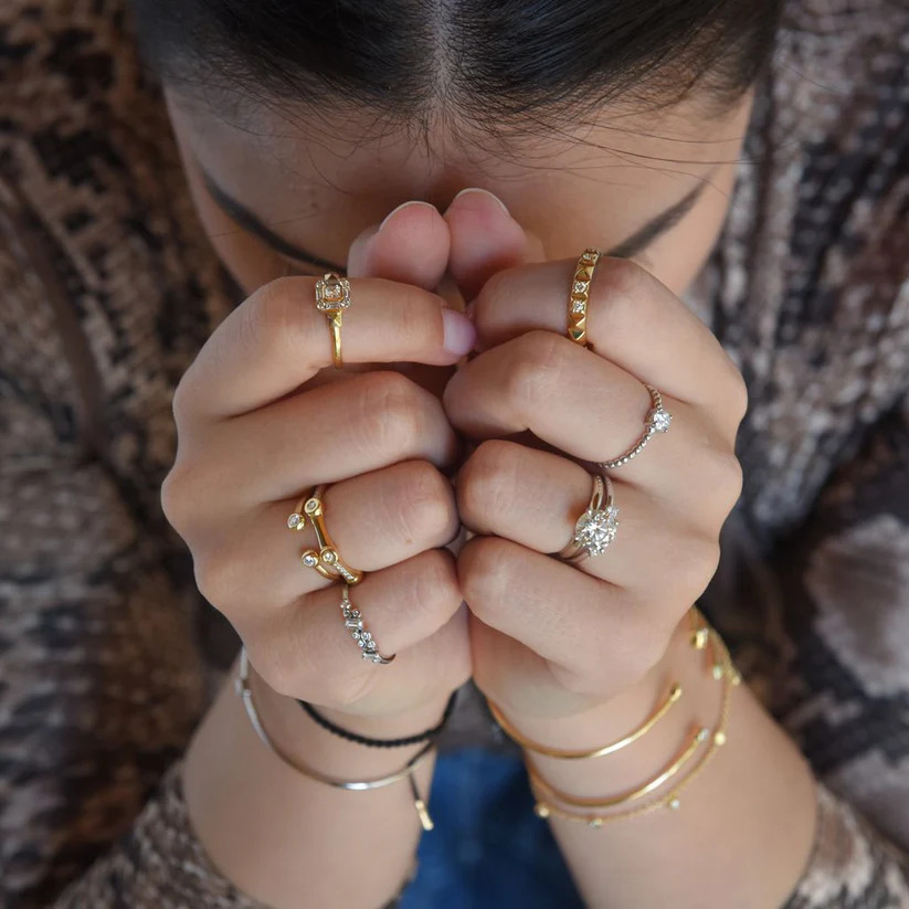 Bride showing her hand wearing Imagine Bridal rings
